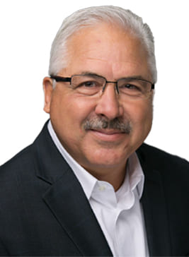 A photograph of Mal McGhee, President/CEO of PCI Manufacturing